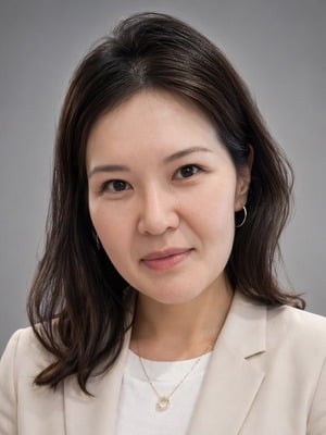 Dr. Shine Dima, board-certified pediatric dentist at Normandy Park Kids Dentistry, smiling portrait.